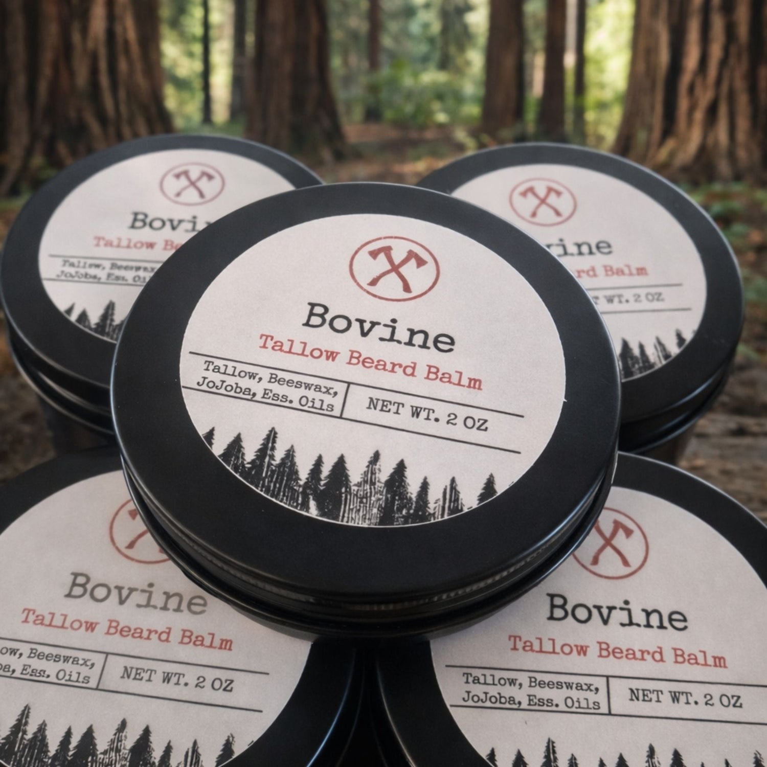 bovine beauty tallow beard balm tins stacked with forest background